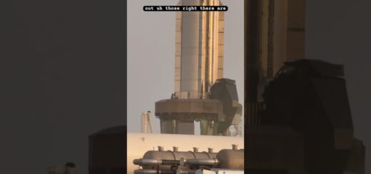 Close-up view of a rocket on the launch pad, showcasing the structure and components of the rocket and launch system.