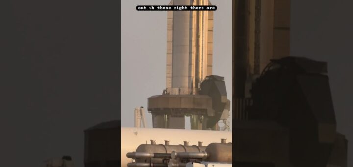 Close-up view of a rocket on the launch pad, showcasing the structure and components of the rocket and launch system.